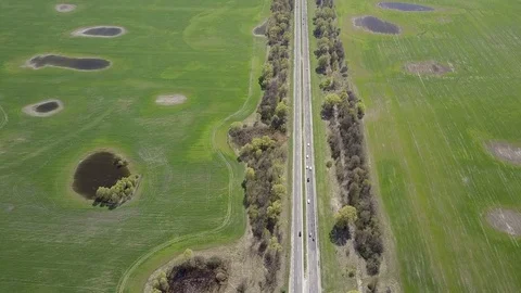 Highway and green field Stockbeeldmateriaal 74795370