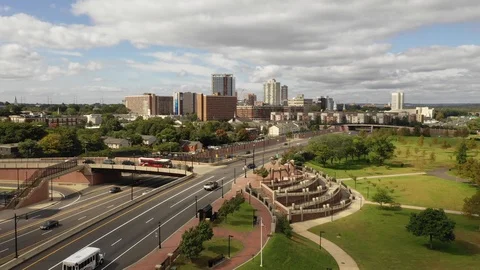 Highway and park plaza below the New Brunswick skyline Stock-Footage 95919005