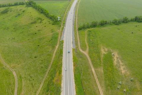 Highway between agriculture fields. Stock Photos