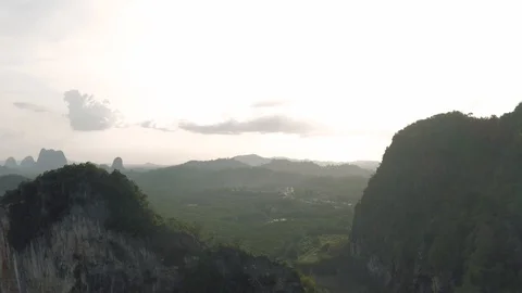 Highway between Mountains and tropical Forest in Asia, Thailand, 4K Drone shot Stock Footage 119797763