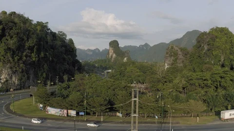 Highway between Mountains and tropical Forest in Asia, Thailand, 4K Drone shot Stock-Footage 119819525