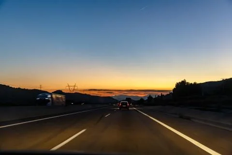 Highway between mountains in the evening Foto stock