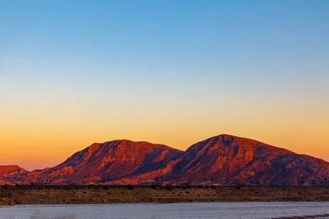 Highway between mountains in the evening Foto stock