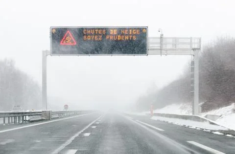 Highway billboard on a snowy day Photos