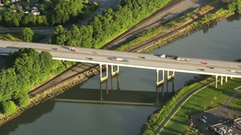 Highway Bridge and Reflection on Warm, Summer Afternoon - Aerial View Stock Footage 11342293