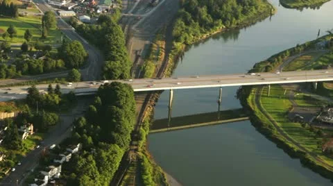 Highway Bridge and Reflection on Warm, Summer Afternoon - Aerial Stock Footage 11342408