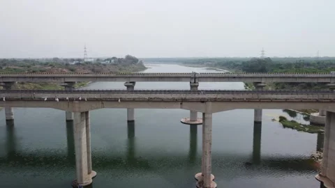 Highway bridge built over the river basin in the Indian rural terrain, Stock Footage 245719618