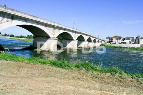Highway bridge through wide river Stock Photos