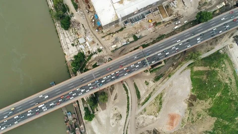 Highway bridge top-down river construction site 02 camera ascending Stock Footage 113390562