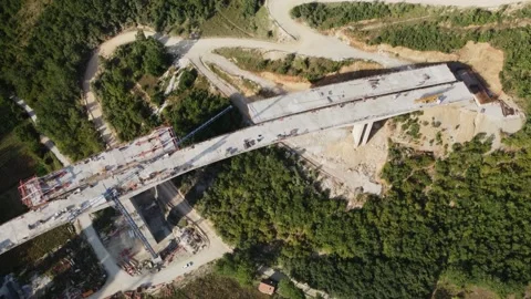 Highway bridge under construction. Aerial view of nes road. Freeway being bui Stock Footage 172292373