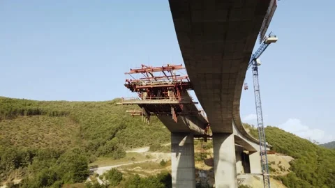 Highway bridge under construction. Aerial view of nes road. Freeway being bui Stock Footage 172293038