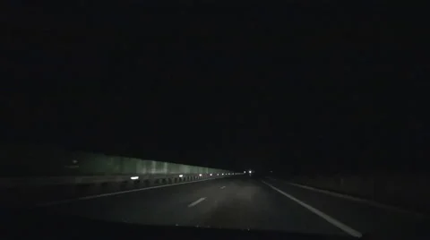Highway car headlights illuminated at night. Night driving. POV. Stock Footage