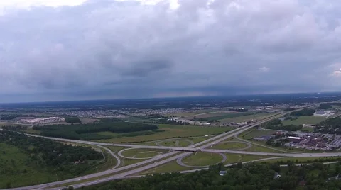 Highway Cloverleaf Interchange, aerial view on a cloudy evening Stock Footage 40366348