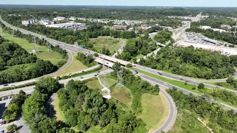 Highway cloverleaf interchange and power lines in Maryland 스톡 동영상 289030965