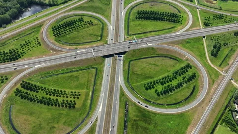 Highway cloverleaf junction with transport infrastructure in Europe Stock Footage 336949636