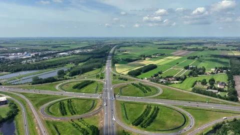Highway cloverleaf junction with transport infrastructure in Europe Stock Footage 336956695