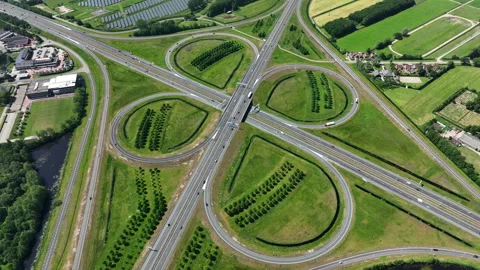 Highway cloverleaf junction with transport infrastructure in Europe Stock Footage 337516382