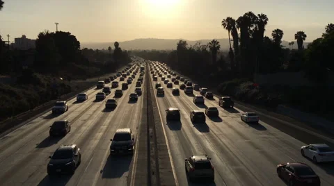 Highway congested with traffic in Los Angeles at dusk Stock Footage 64642665