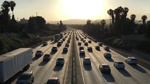 Highway congested with traffic in Los Angeles at dusk Stock Footage 64642679