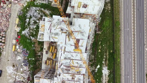 Highway construction with crane. Drone captures highway building activity. Stock Footage 337909093