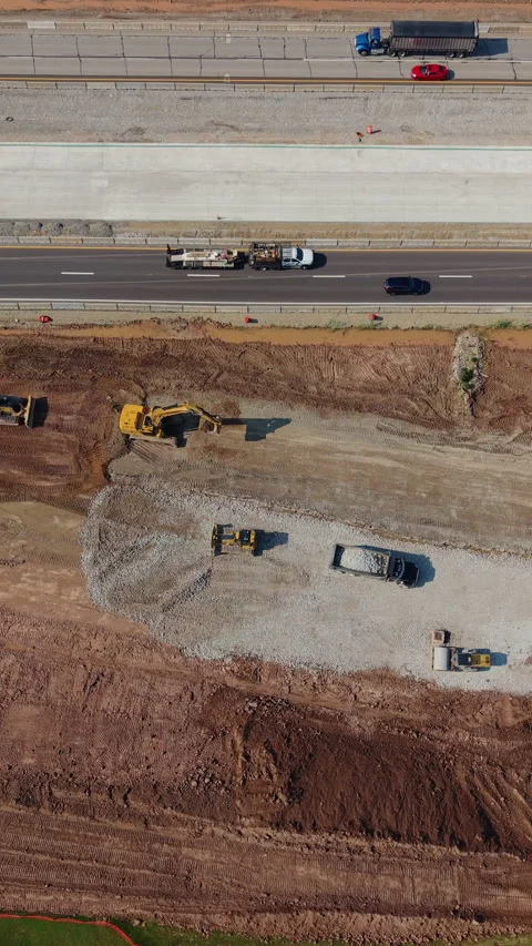 Highway Construction Earthmoving Machinery Working Along Road Shoulder Stock Footage 342591175