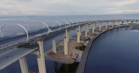 Highway construction. A long highway bridge crossing the gulf. Aerial drone foot 库存影片 70121066