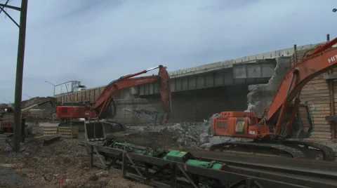 Highway construction site as back hoe maneuvers Video stock 49893260
