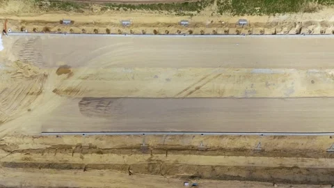 Highway Construction Site with Leveled Ground and Road Infrastructure Works Stock Footage 315520203