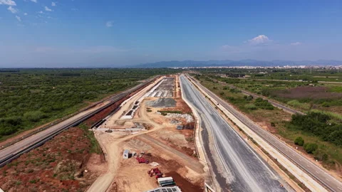 Highway construction site with partially completed road lanes, exposed Stock Footage 336741554