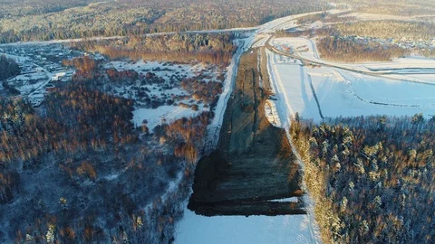 Highway construction in winter. Deforestation and Development a transport road Stock Footage 127569065