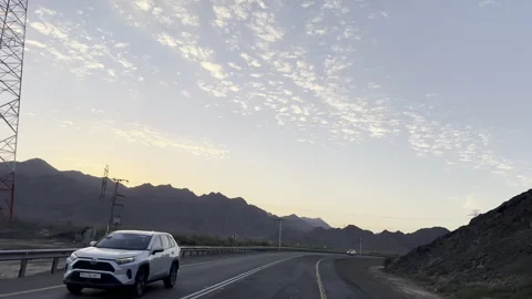 Highway Drive at Dusk Under Dramatic Twilight Sky Stock Footage 323525453