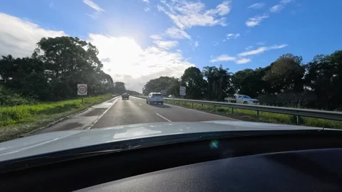 Highway Driving from Car Dash Point of View in Bright Morning Sunlight Stock Footage 345020519