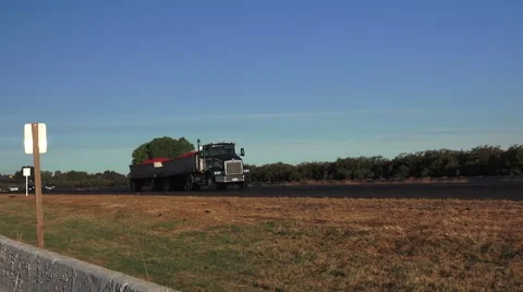 HIGHWAY, driving Loaded big rig with tomatoes Stock Footage 55451537