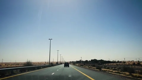 Highway driving through desert towards Dubai UAE 1 Stock Footage 248984535