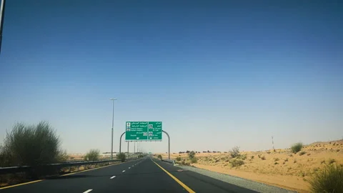 Highway driving through desert towards Dubai UAE 3 Stock Footage 248984552