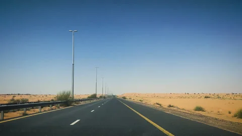 Highway driving through desert towards Dubai UAE 2 Stock Footage 248984642