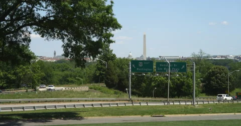 Highway E50 sign with Washington DC in background. Shot in May 2012. Stock Footage 59299184