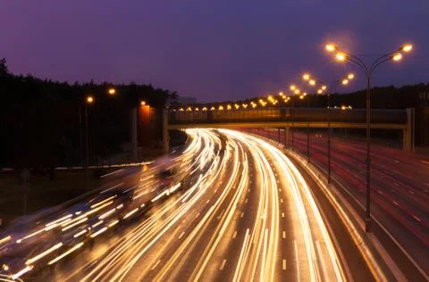 Highway at evening Stock Photos