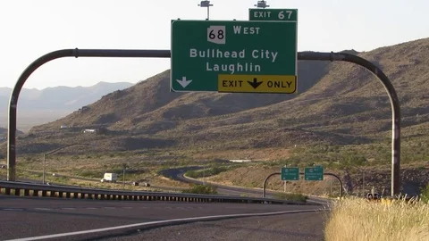 Highway Exit Signs for Bullhead City AZ and Las Vegas NV near Kingman Stock Footage