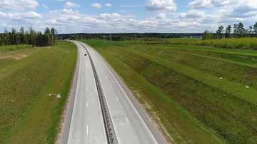 Highway, fields and forests surrounding, aerial shot Stock Footage 86156956