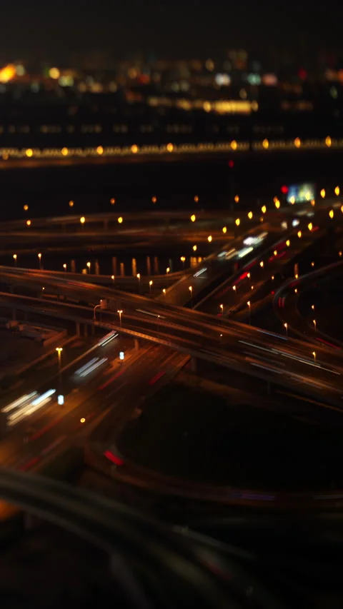 Highway interchange with car light trails at night, Dubai timelapse Video stock 340471349