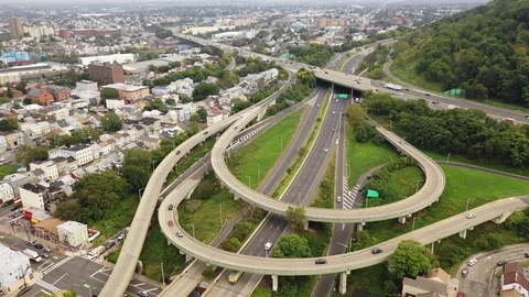 Highway interchange loops beside a Paterson ridge Видео 95960523