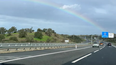 Highway interchange toward Lisbon under rainbow Видео 329776576