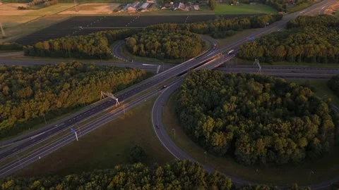 Highway interchange traffic flowing at sunset Stock Footage 314071486