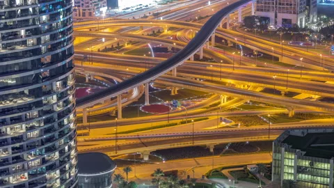 Highway intersection and overpass of Dubai downtown aerial night timelapse. Stock Footage 167659335