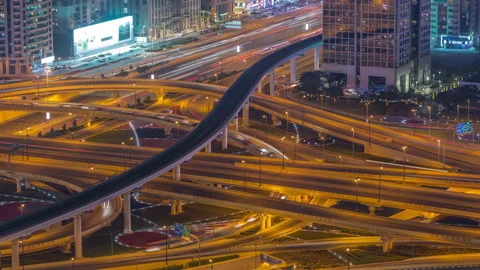 Highway intersection and overpass of Dubai downtown aerial night timelapse. Stock Footage 167659357