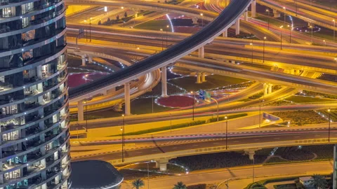 Highway intersection and overpass of Dubai downtown aerial night timelapse. Stock Footage 211659970