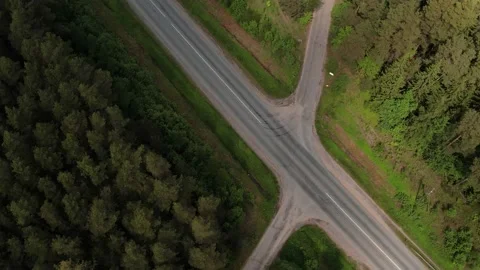 Highway with intersection and traffic. Around the forest. Aerial view Stock Footage 206283239