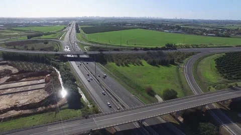 HIGHWAY INTERSECTION WITH GREEN FIELDS Vídeos de archivo 72358509