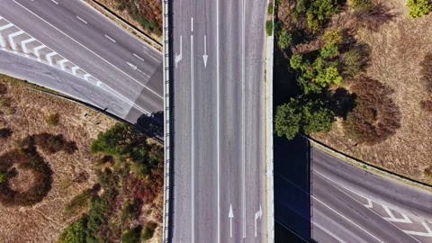 Highway intersection viewed from above with clear markings and green Video stock 347751621